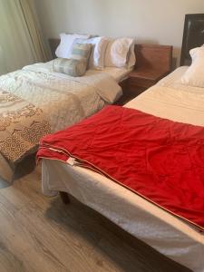 two beds sitting next to each other in a room at Montreal Downtown Private Room in Montreal +14 photos