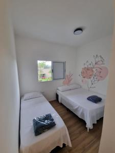 Katil atau katil-katil dalam bilik di Casa Moderna com Itens de Lazer