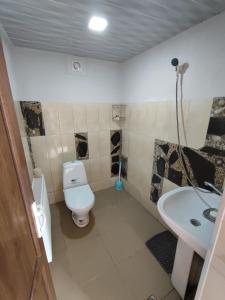 A bathroom at Qusha Guesthouse Meeting in the mountains and views