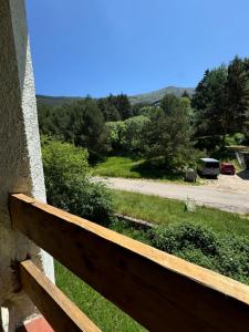 a view of a yard from a wooden fence at El Chozo in La Pinilla