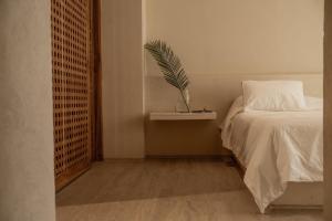 En eller flere senge i et værelse på Apartamento Centro Historico Santa Marta