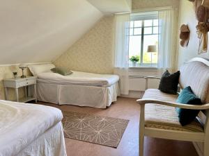 Postel nebo postele na pokoji v ubytování Sörbygården Bed & Breakfast