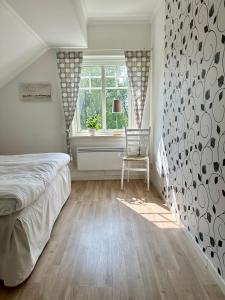 Postel nebo postele na pokoji v ubytování Sörbygården Bed & Breakfast