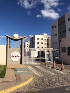 a gate with cones in front of a building at Apto 2 quartos com ar - Fechadura eletrônica - Até 8 pessoas in Petrolina