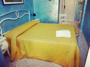 Postel nebo postele na pokoji v ubytování B&B Appartamenti l'Anfora