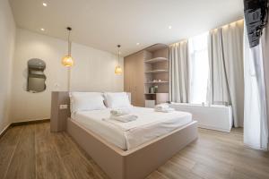 Postel nebo postele na pokoji v ubytování Mari Al Deluxe Saranda