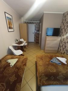 Postel nebo postele na pokoji v ubytování El Jan Pobierowo - Zadzwoń!