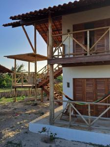 a house under construction with a wooden roof at Casa Vento - 2 Andares e Cozinha in Luis Correia