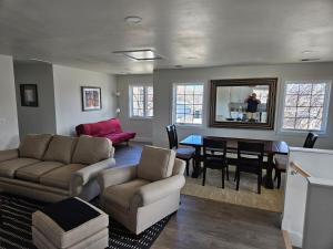 a living room with a couch and a table at Sunny Beautiful Apt, 2nd Level, 2Bedroom, 2Bath, Kitchen, Dining in Denver