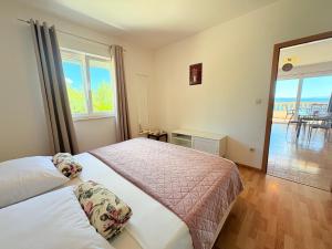 Posteľ alebo postele v izbe v ubytovaní Apartment Elza + 37 fotografií