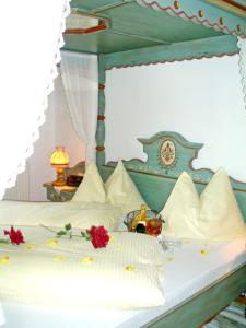 Letto o letti in una camera di Naturhotel Hüttenwirt im Grossarltal