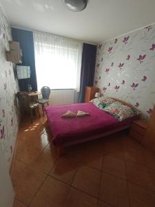 Postel nebo postele na pokoji v ubytování El Jan Pobierowo - Zadzwoń!