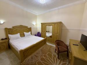 Postel nebo postele na pokoji v ubytování SKY HoTEL