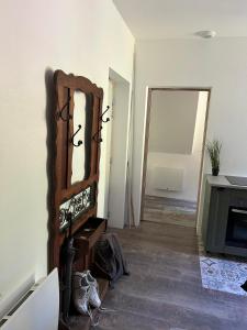 a room with a mirror on a wall at Senones Jardin de la princesse in Senones