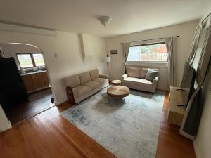 a living room with a couch and a table at New Listing, Blue Cabin, Downtown, Cozy Getaway in Driggs