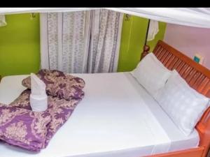 Ένα ή περισσότερα κρεβάτια σε δωμάτιο στο Mango Lodge
