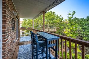 a blue table and chairs on the porch of a house at Family Friendly 2BR Condo with Large Balcony, Partial Ocean Views in Ocean City