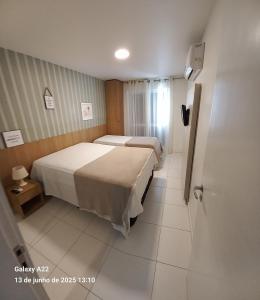 Ένα ή περισσότερα κρεβάτια σε δωμάτιο στο MANDAI Apartamento Cabo Frio +76 φωτογραφίες