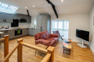 a living room with a couch and a table at Town Center Duplex 6 in Harrogate