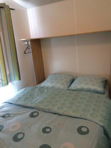 Ένα ή περισσότερα κρεβάτια σε δωμάτιο στο Camping Mussonville