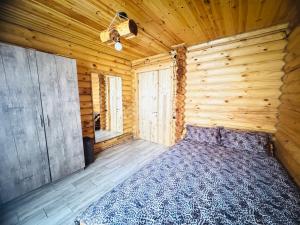 Postel nebo postele na pokoji v ubytování Деревянный дом