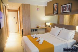 Postel nebo postele na pokoji v ubytování Premier Flat Premium Queimados + 24 fotografií