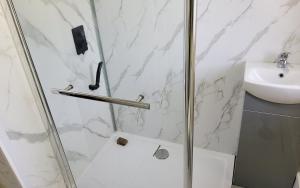 a bathroom with a shower and a sink at Sure stay property in Bolton