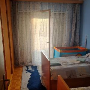 Postel nebo postele na pokoji v ubytování Apartman Mina