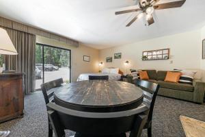 a living room with a table and a bedroom at 134 Bldg C studio in Truckee