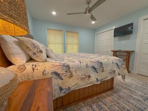a bedroom with a bed and a flat screen tv at B6 Little Bay Landing Long Term in Rockport +16 photos