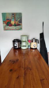 a wooden table with pots and pans on top of it at Maison Serra - Jacuzzi, Sauna in Collioure