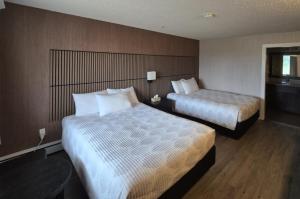 Postel nebo postele na pokoji v ubytování Hotel Moncton