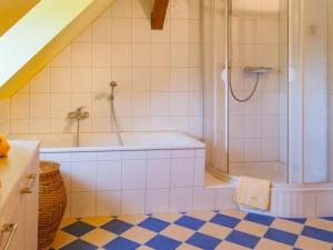 a bathroom with a shower and a tub at Holiday apartment in Tharandt with Wi-Fi in Tharandt +16 photos