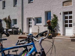 two bikes parked in front of a building at Holiday apartment with 2 bedrooms in Kurort Hartha