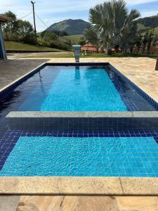 Swimmingpoolen hos eller tæt på Chácara Recanto do Sossego - Monte Sião