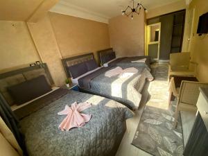 Voodi või voodid majutusasutuse Sunset Hostel toas