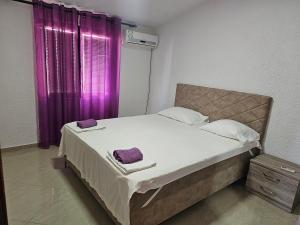 Postel nebo postele na pokoji v ubytování Esko Rooms