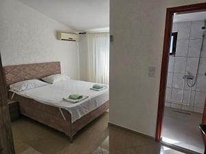 Postel nebo postele na pokoji v ubytování Esko Rooms