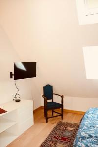 TV a/nebo společenská místnost v ubytování Au cœur de la Citadelle