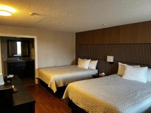 Postel nebo postele na pokoji v ubytování Hotel Moncton