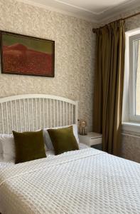 Postel nebo postele na pokoji v ubytování Kulautuva Park Apartments