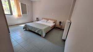 Postel nebo postele na pokoji v ubytování Spiros House