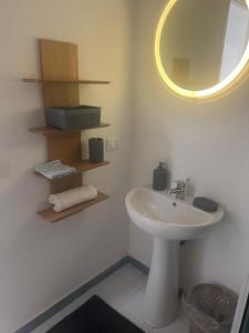 a bathroom with a sink and a mirror at cielo blu in San Vito lo Capo