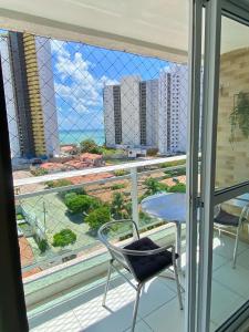 Balkon atau teras di Varandas Premium flat
