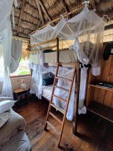 Cama ou camas em um quarto em Vila do Junco