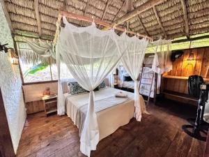 Cama ou camas em um quarto em Vila do Junco