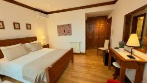 Uma cama ou camas num quarto em Quinta de CasalMato