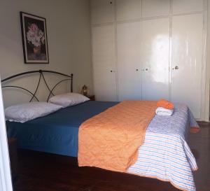 a bedroom with two beds with towels on them at Comfort bed in a room 5' from metro in Athens
