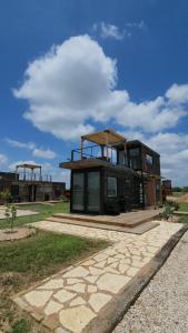 a building with a roof on top of it at Barossa Valley Station Patio 1br Downtown in Fredericksburg