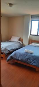 En eller flere senge i et værelse på Departamento en Misicata